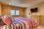 Couloir Cabin master with queen log bed. 